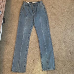 In the Style, new with tags, never worn, boot cut with slit front